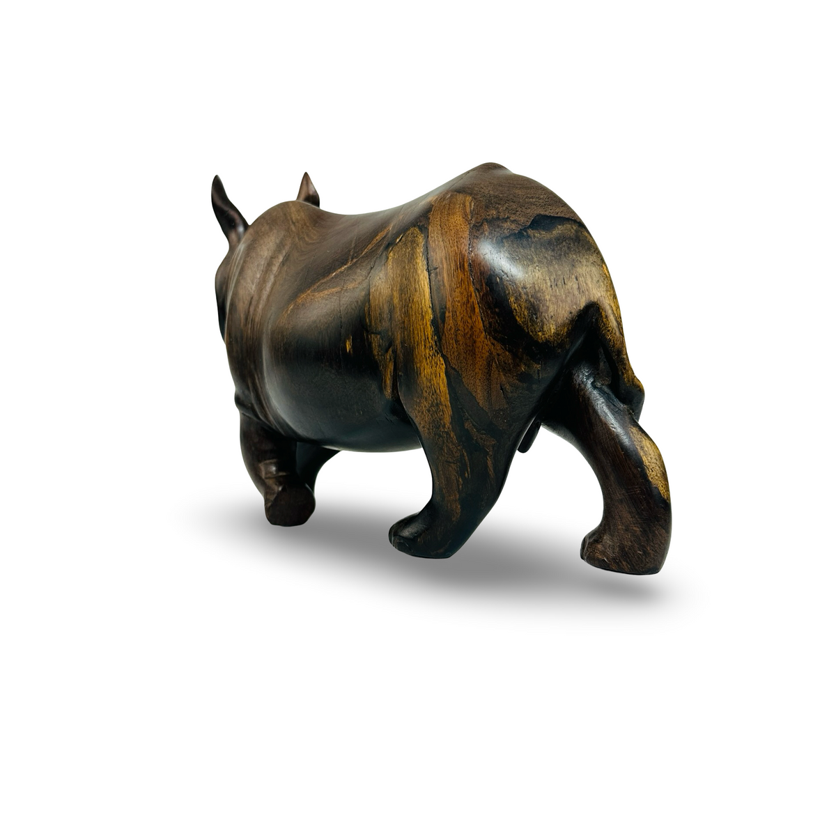 Rückansicht der Nashorn Holzfigur mit goldbraunen Splintholzpartien und eingerolltem Schwanz