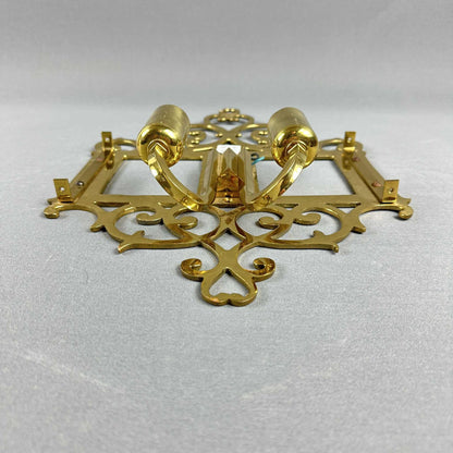 Draufsicht auf die Rückseiten der Messing-Wandleuchten mit sichtbaren Fassungen und Haltern