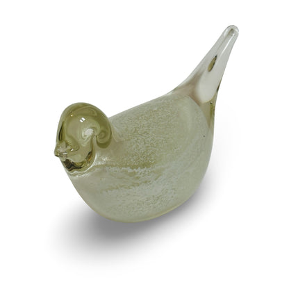 Glass bird viewed from above, with a straw-yellow tinted head and white powder core in the body