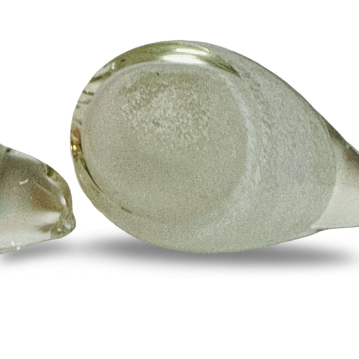 Polished, unsigned base of a glass bird with a translucent powder core