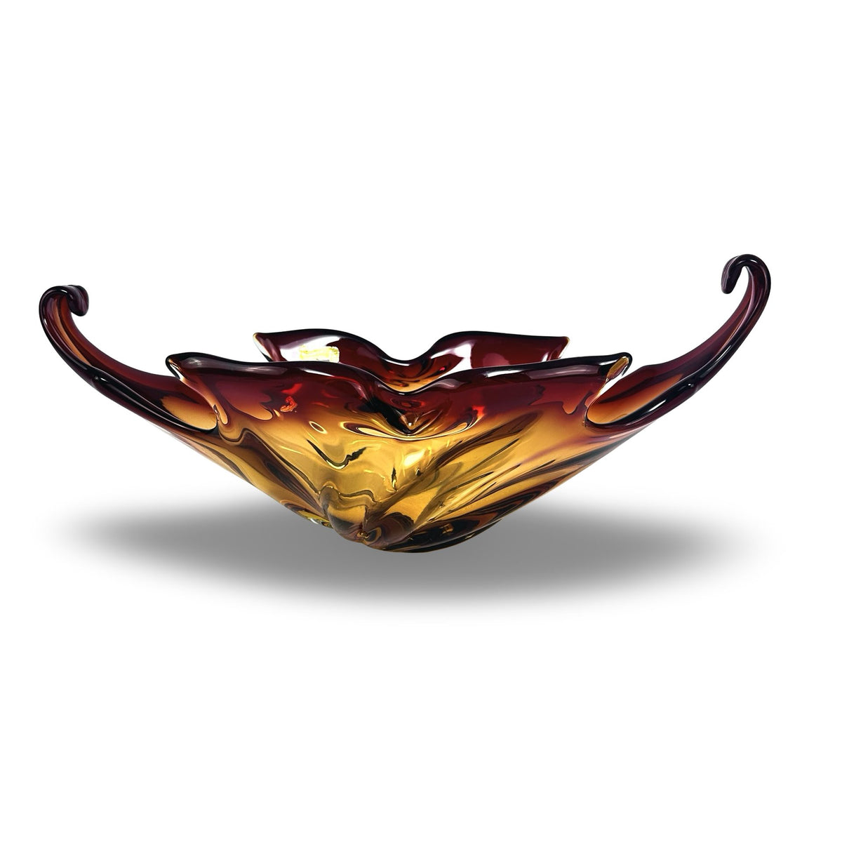 Vintage Murano Sommerso bowl in amber and ruby red with curled scroll ends, front view