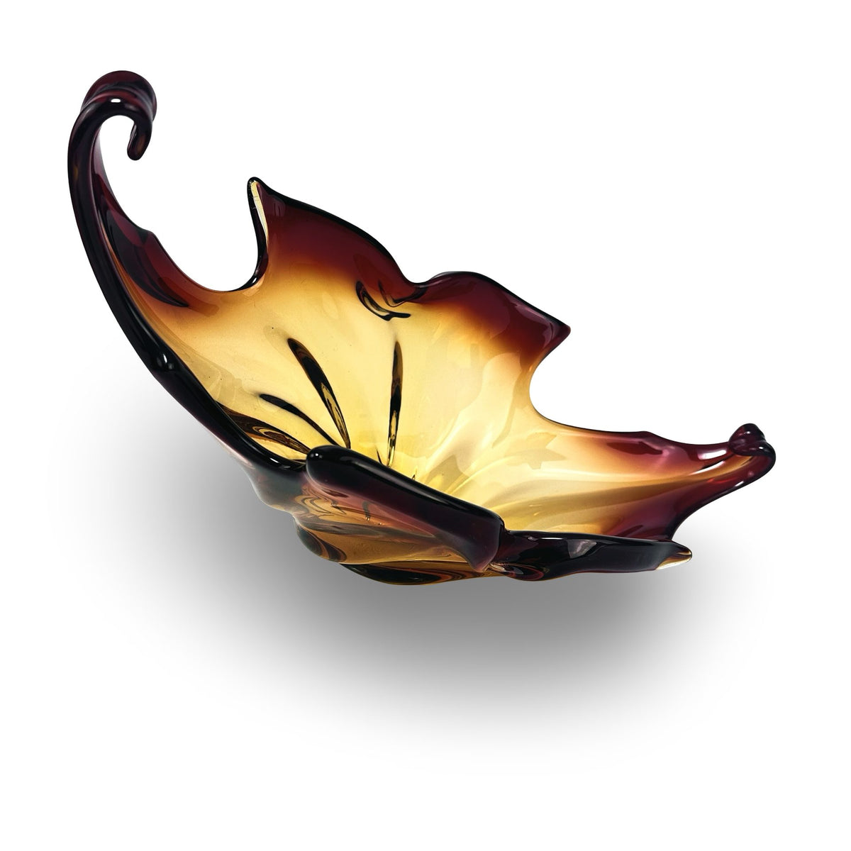 Murano bowl tilted, view into the honey-gold amber core with twisted ribs