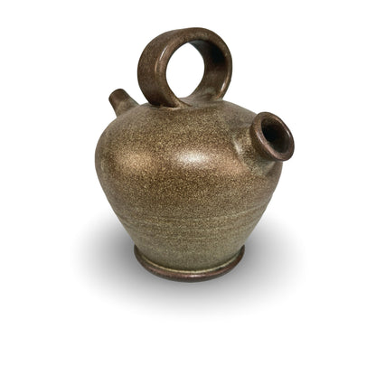 Slightly elevated view of the Vallauris gargoulette with broad ring handle and rolled-rim filling opening