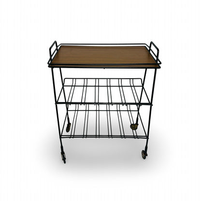 Front view of the black wire trolley with handles on both sides and four swivel castors