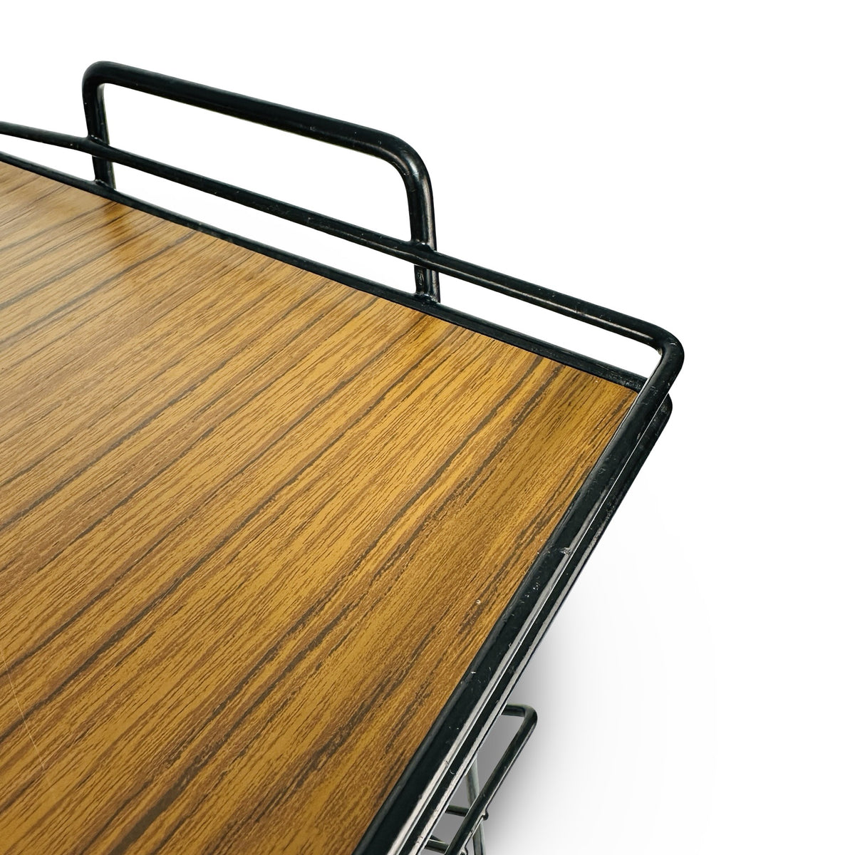 Detail of the wood-grain tray in the black wire gallery with handle